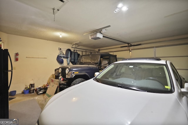 83 Pinewood Ln, Allenhurst, GA 31301 - garage featuring a garage door opener