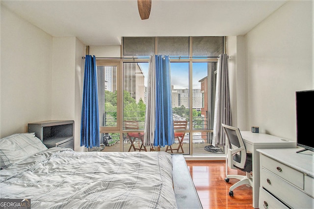 171 Auburn Ave NE Unit 521, Atlanta, GA 30303 - bedroom featuring access to exterior, an office area, and wood finished floors