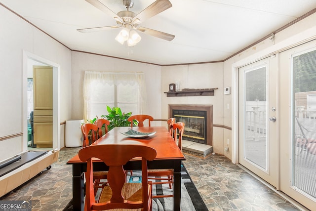 294 Birch Rd, Franklin, GA 30217 - dining area featuring stone flooring, crown molding, a glass covered fireplace, and ceiling fan