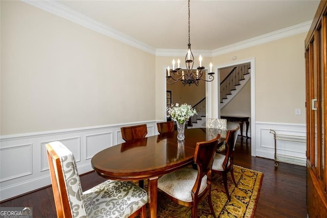 6110 Read Rd, Suwanee, GA 30024 - dining space featuring a chandelier, crown molding, dark wood-style floors, wainscoting, and stairs