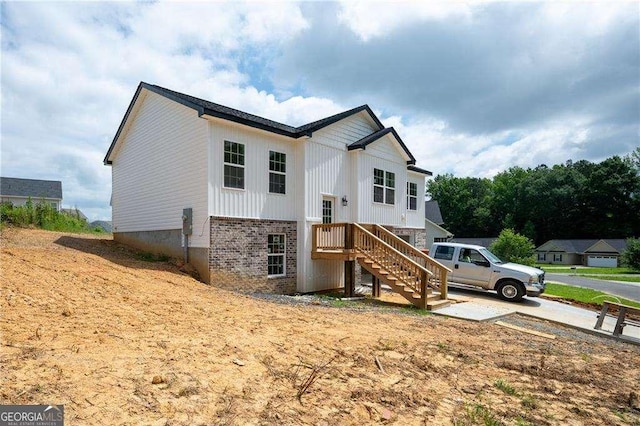 373 Lakecrest Cir SW, Calhoun, GA 30701 - view of front of house with stairway and board and batten siding