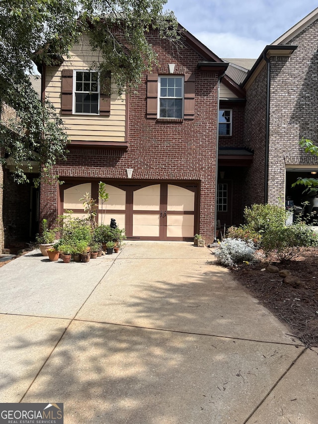 5211 Montine Way, Peachtree Corners, GA 30092 - view of front facade featuring driveway, brick siding, and an attached garage