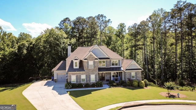 1032 Switchgrass Dr, Statham, GA 30666 - craftsman-style home featuring driveway, a chimney, an attached garage, a front yard, and a porch