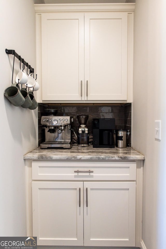 1032 Switchgrass Dr, Statham, GA 30666 - bar area featuring tasteful backsplash