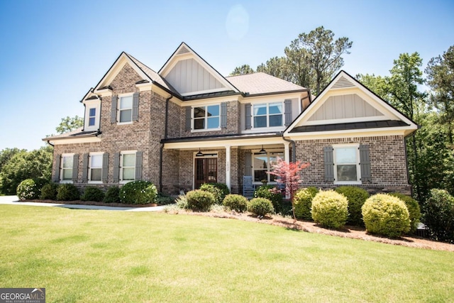 1032 Switchgrass Dr, Statham, GA 30666 - craftsman inspired home with board and batten siding, brick siding, and a front lawn