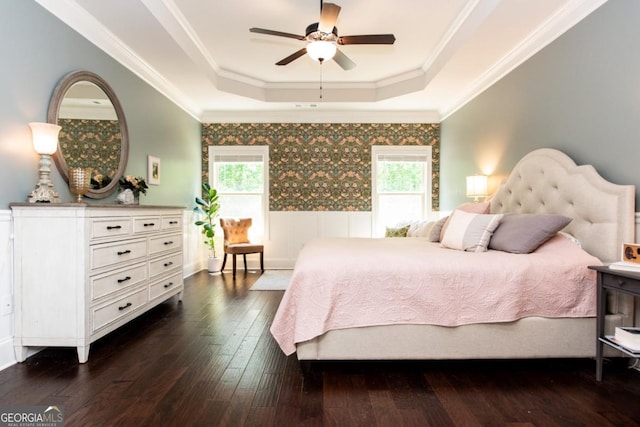 1032 Switchgrass Dr, Statham, GA 30666 - bedroom featuring a tray ceiling, multiple windows, a wainscoted wall, dark wood-style flooring, and ornamental molding