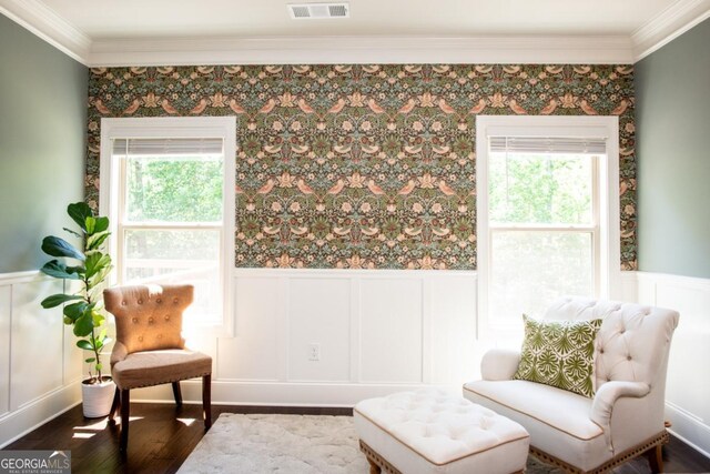 1032 Switchgrass Dr, Statham, GA 30666 - sitting room with ornamental molding, a wainscoted wall, a decorative wall, and dark wood-style flooring