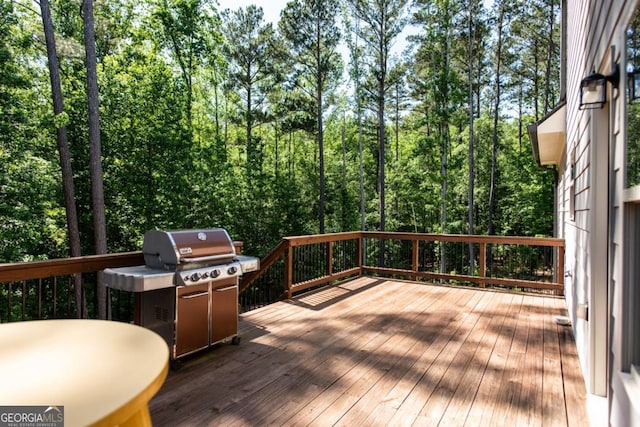1032 Switchgrass Dr, Statham, GA 30666 - wooden deck featuring a wooded view
