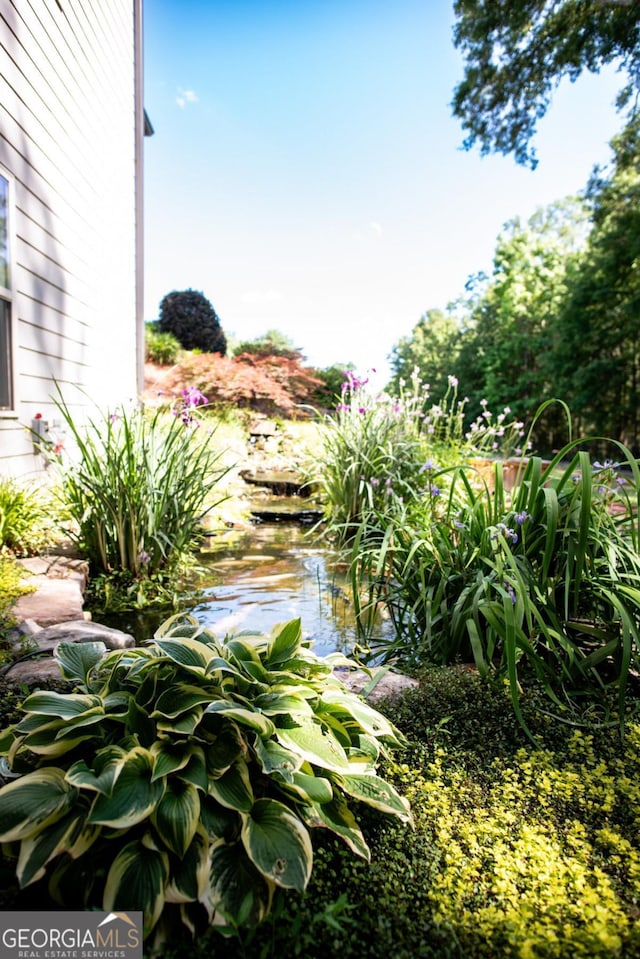 1032 Switchgrass Dr, Statham, GA 30666 - view of yard with a garden pond