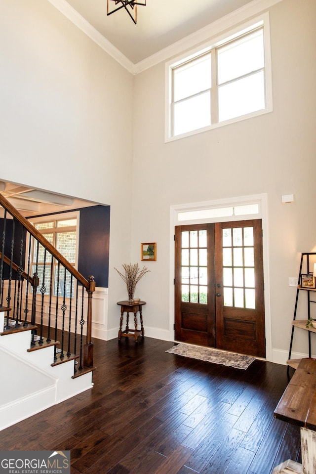 1032 Switchgrass Dr, Statham, GA 30666 - entryway with a high ceiling, stairway, crown molding, hardwood / wood-style flooring, and plenty of natural light