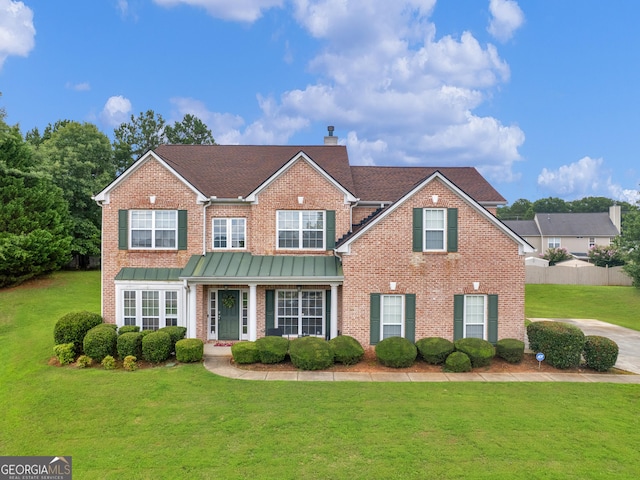 1613 Brolington Ct, Conyers, GA 30013 - traditional home with brick siding, a front lawn, a chimney, and a shingled roof