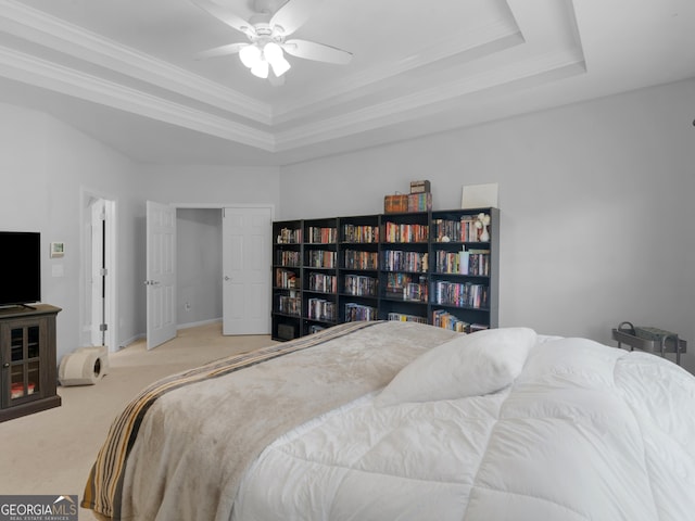 1613 Brolington Ct, Conyers, GA 30013 - carpeted bedroom featuring a tray ceiling, ornamental molding, and a ceiling fan