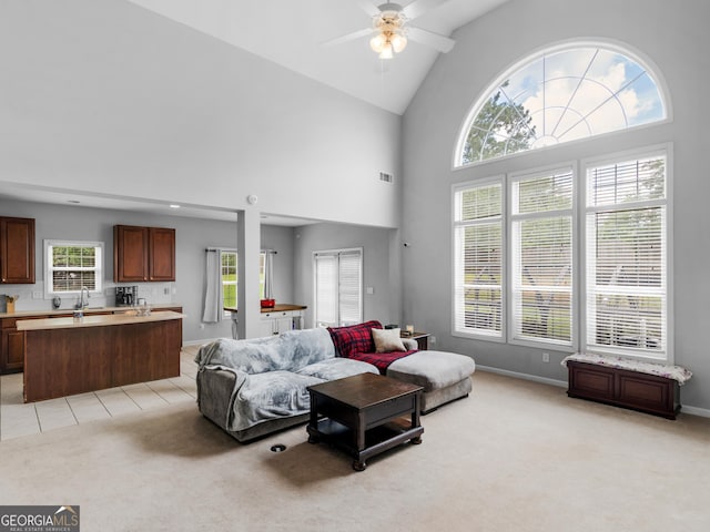 1613 Brolington Ct, Conyers, GA 30013 - living room featuring light colored carpet, ceiling fan, and high vaulted ceiling