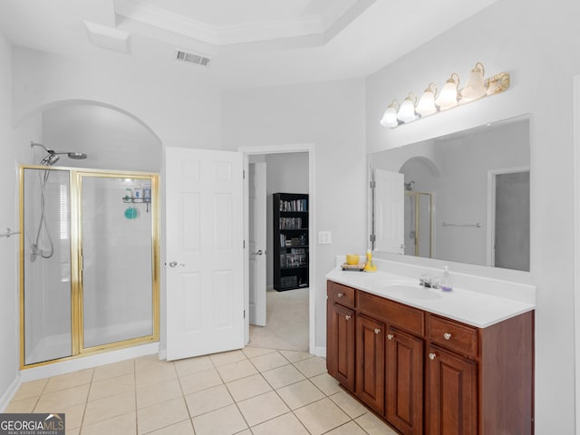 1613 Brolington Ct, Conyers, GA 30013 - bathroom featuring a stall shower, vanity, tile patterned floors, ornamental molding, and a tray ceiling