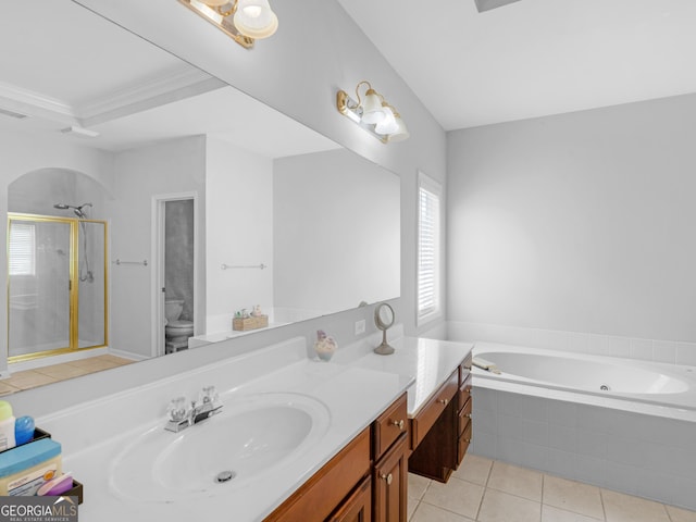 1613 Brolington Ct, Conyers, GA 30013 - bathroom featuring vanity, a tub with jets, a shower stall, tile patterned floors, and ornamental molding