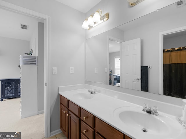 1613 Brolington Ct, Conyers, GA 30013 - full bathroom with double vanity and baseboards