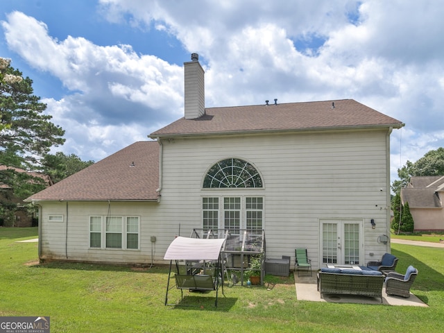 1613 Brolington Ct, Conyers, GA 30013 - rear view of property with french doors, a patio area, a chimney, a yard, and roof with shingles