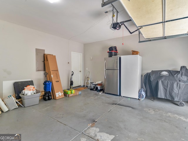 1613 Brolington Ct, Conyers, GA 30013 - garage with freestanding refrigerator, electric panel, and a garage door opener
