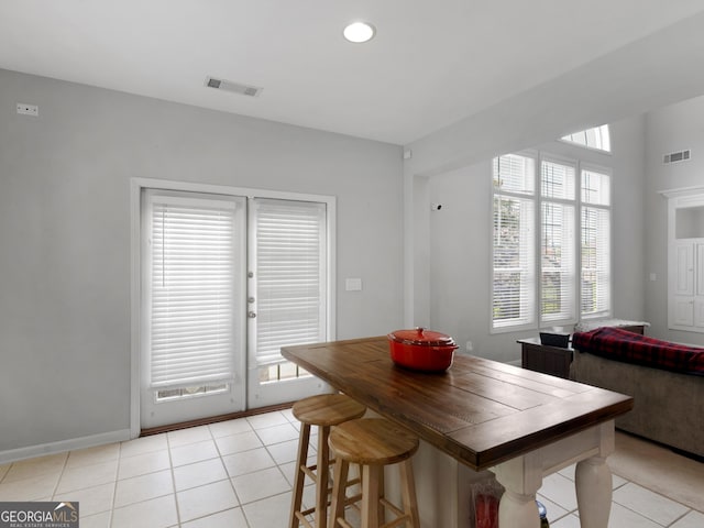 1613 Brolington Ct, Conyers, GA 30013 - dining space featuring light tile patterned floors, plenty of natural light, and recessed lighting