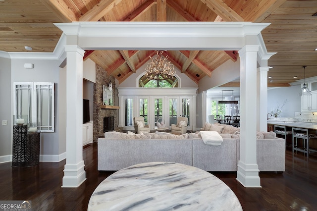 177 Selfridge Rd, Mcdonough, GA 30252 - living area featuring wood ceiling, a chandelier, beverage cooler, dark wood-type flooring, and a stone fireplace