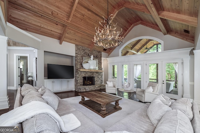 177 Selfridge Rd, Mcdonough, GA 30252 - living room featuring wood ceiling with exposed beams, a chandelier, a fireplace, high vaulted ceiling, and wood finished floors
