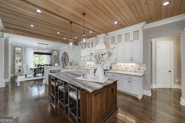 177 Selfridge Rd, Mcdonough, GA 30252 - kitchen with a peninsula, wood ceiling, recessed lighting, glass insert cabinets, and white cabinets
