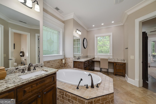 177 Selfridge Rd, Mcdonough, GA 30252 - bathroom with two vanities, a garden tub, crown molding, and recessed lighting