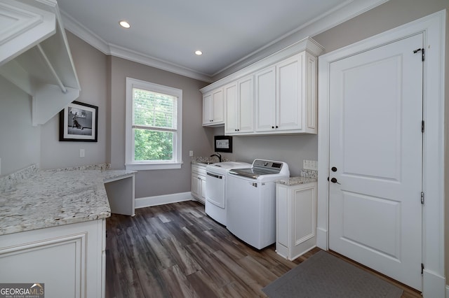 177 Selfridge Rd, Mcdonough, GA 30252 - washroom with ornamental molding, cabinet space, washer and dryer, dark wood-style flooring, and baseboards