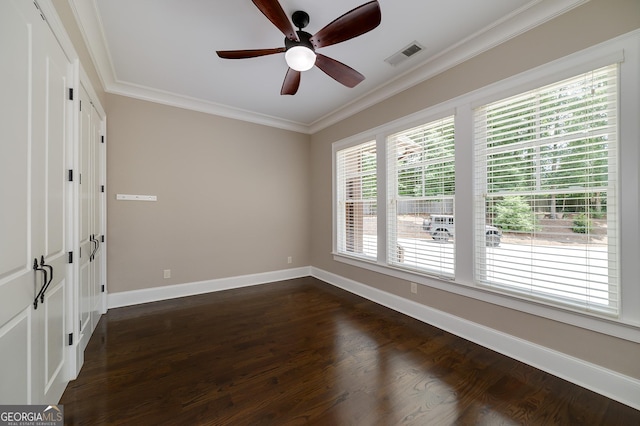 177 Selfridge Rd, Mcdonough, GA 30252 - spare room featuring a ceiling fan, dark wood-style flooring, and crown molding