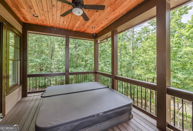 177 Selfridge Rd, Mcdonough, GA 30252 - wooden deck featuring ceiling fan, a covered hot tub, and a forest view