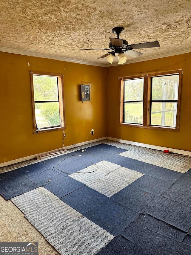 796 Shoemaker Rd, West Point, GA 31833 - carpeted spare room with a ceiling fan, crown molding, electric panel, and baseboards