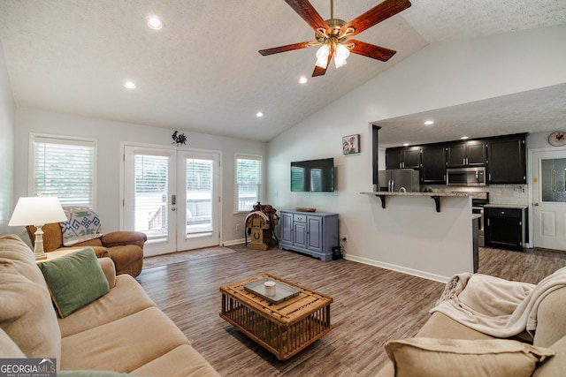 82 Post Oak Cir, Crawford, GA 30630 - living area featuring lofted ceiling, french doors, wood finished floors, recessed lighting, and a ceiling fan
