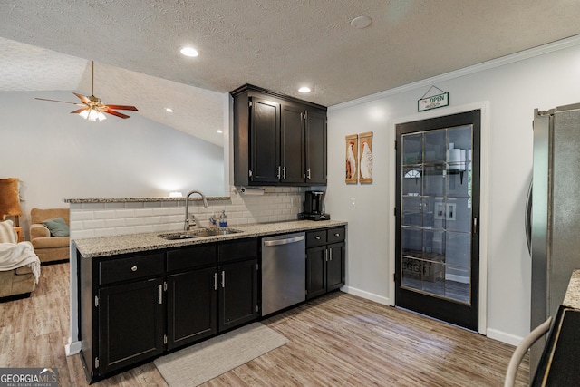 82 Post Oak Cir, Crawford, GA 30630 - kitchen featuring stainless steel appliances, a sink, ceiling fan, light wood finished floors, and tasteful backsplash
