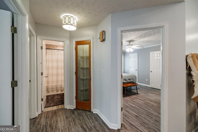 82 Post Oak Cir, Crawford, GA 30630 - hall with a textured ceiling, dark wood-type flooring, and baseboards