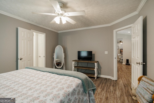 82 Post Oak Cir, Crawford, GA 30630 - bedroom featuring wood finished floors, baseboards, a textured ceiling, crown molding, and a ceiling fan