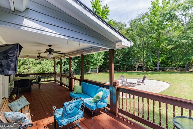 82 Post Oak Cir, Crawford, GA 30630 - deck featuring ceiling fan, view of wooded area, and a fire pit