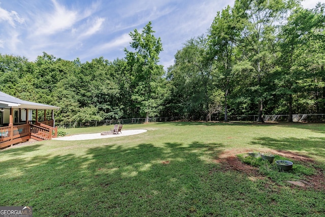 82 Post Oak Cir, Crawford, GA 30630 - view of yard featuring a deck and a fire pit
