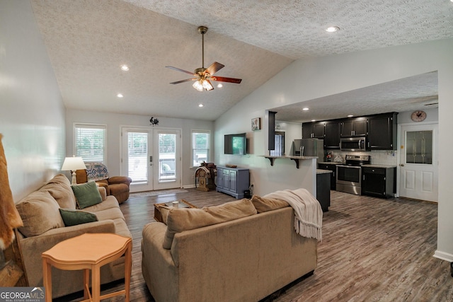 82 Post Oak Cir, Crawford, GA 30630 - living room with a textured ceiling, dark wood-type flooring, french doors, a ceiling fan, and high vaulted ceiling