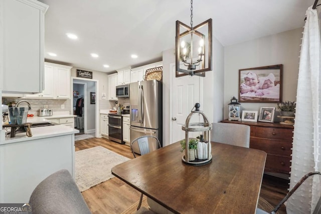 76 Lightning Rdg, Dawsonville, GA 30534 - dining room featuring light wood finished floors, recessed lighting, and a chandelier