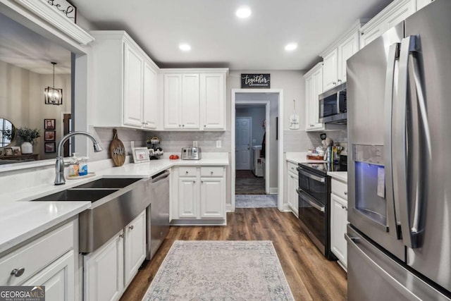 76 Lightning Rdg, Dawsonville, GA 30534 - kitchen with stainless steel appliances, a sink, white cabinetry, decorative backsplash, and recessed lighting