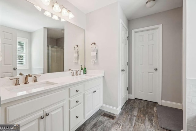 76 Lightning Rdg, Dawsonville, GA 30534 - bathroom with a shower stall, double vanity, wood finished floors, and baseboards