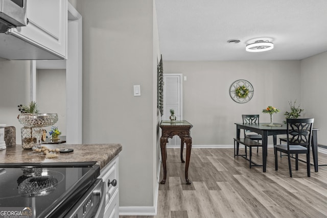 3182 Willow Creek Rd, Augusta, GA 30909 - dining space featuring light wood-style flooring and baseboards