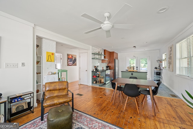 278 Fourth St, Athens, GA 30601 - dining space with a ceiling fan, light wood-type flooring, and baseboards