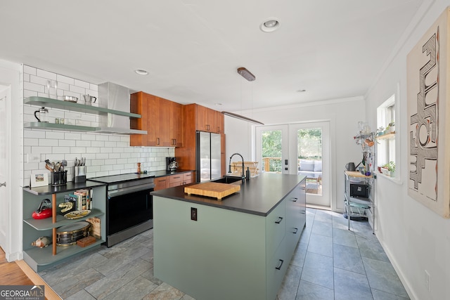 278 Fourth St, Athens, GA 30601 - kitchen with open shelves, appliances with stainless steel finishes, dark countertops, a sink, and crown molding