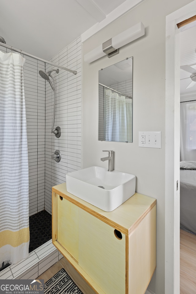 278 Fourth St, Athens, GA 30601 - full bath featuring curtained shower, vanity, and wood finished floors