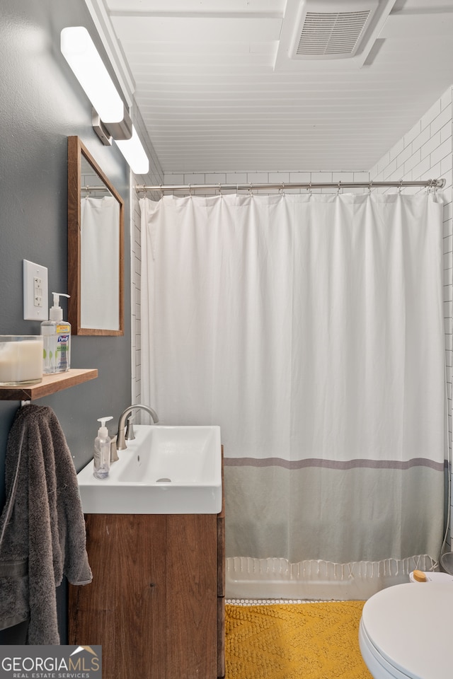 278 Fourth St, Athens, GA 30601 - bathroom featuring vanity, toilet, and a shower with curtain