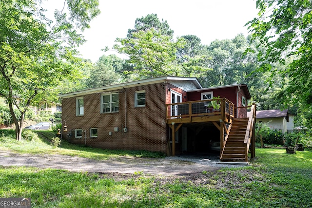 278 Fourth St, Athens, GA 30601 - rear view of house featuring stairway, a deck, a carport, and asphalt driveway