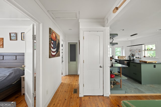 278 Fourth St, Athens, GA 30601 - hall with light wood-style flooring, attic access, recessed lighting, a sink, and baseboards