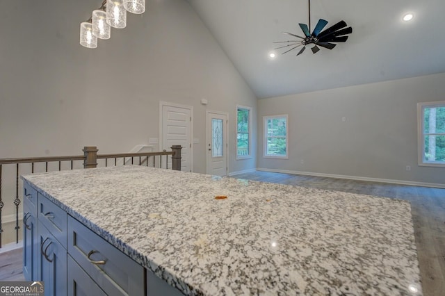 48 Bluejay Ct, Monticello, GA 31064 - kitchen featuring high vaulted ceiling, light wood-style floors, a kitchen island, baseboards, and a ceiling fan