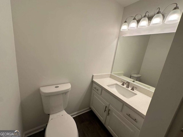11 Long Branch Xing, Dahlonega, GA 30533 - bathroom featuring toilet, vanity, wood finished floors, and baseboards